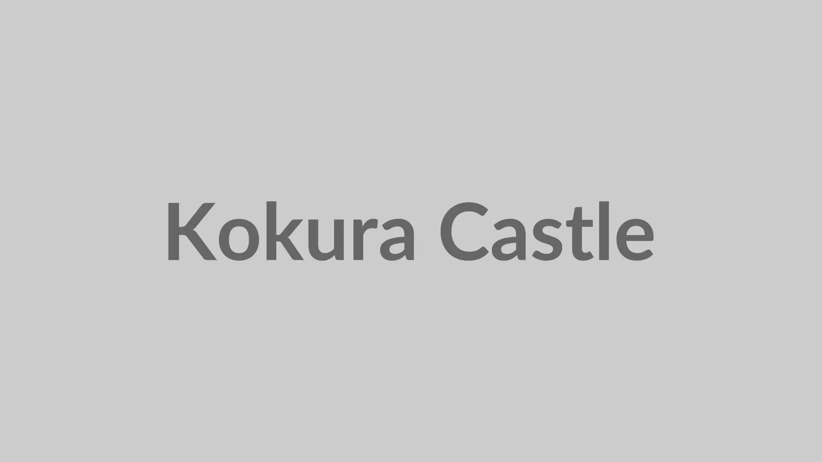 Kokura Castle main keep with the south stone wall in late-afternoon light