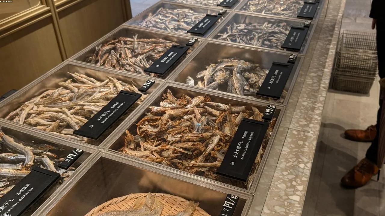 Fresh fish displayed at a Tanga Market counter, whole tai and yellowtail lined up on ice